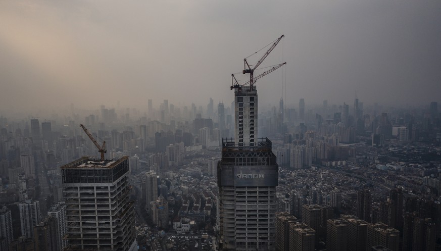 epa09538461 A photo made with a drone shows a construction site in Shanghai, China, 22 October 2021. According to the state-owned media, China Evergrande Group, the world&#039;s most indebted property ...