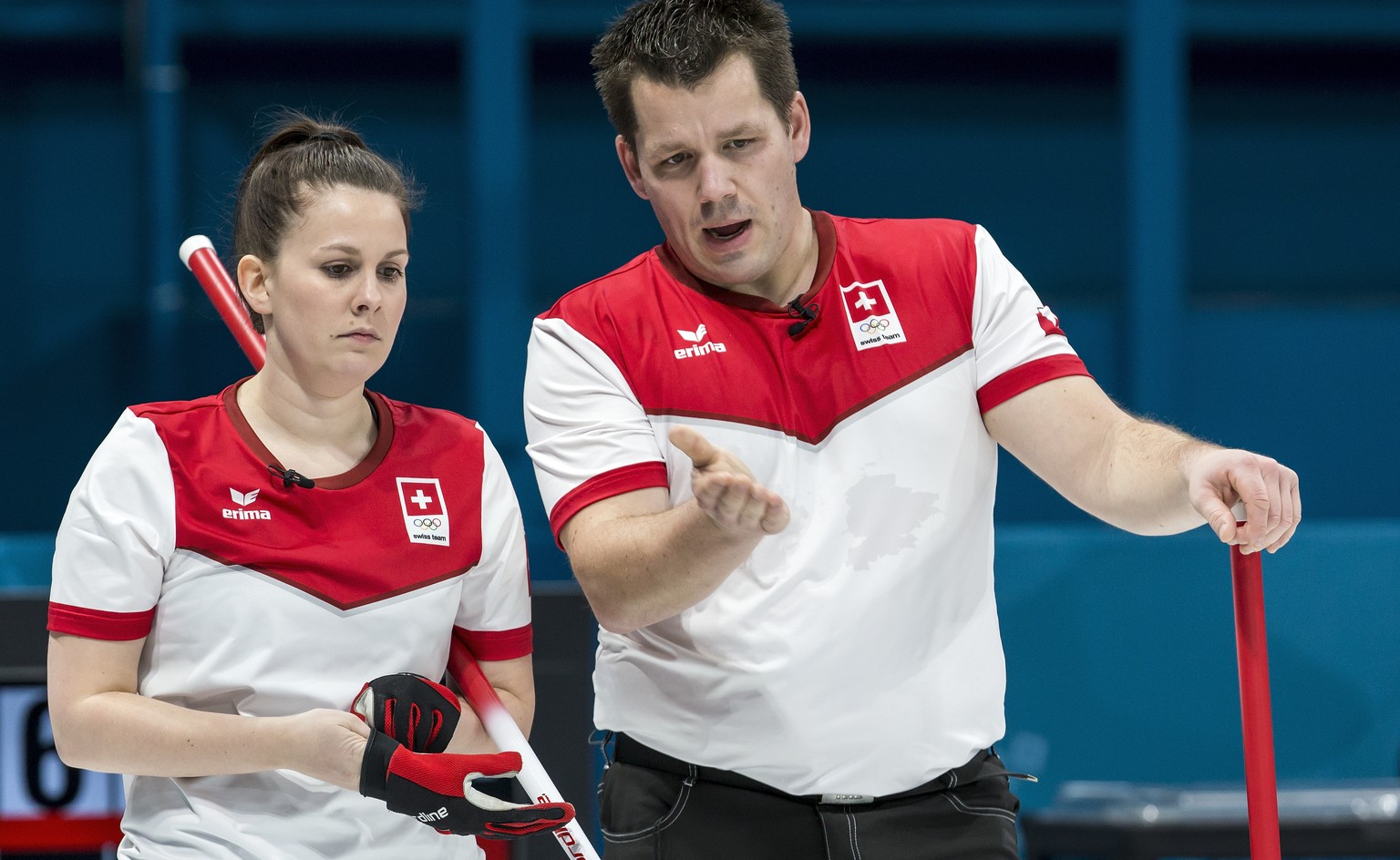 Jenny Perret of Switzerland and Martin Rios of Switzerland in action, from left, during the Mixed Doubles Curling round robin game between Switzerland and Finland one day prior to the opening of the X ...