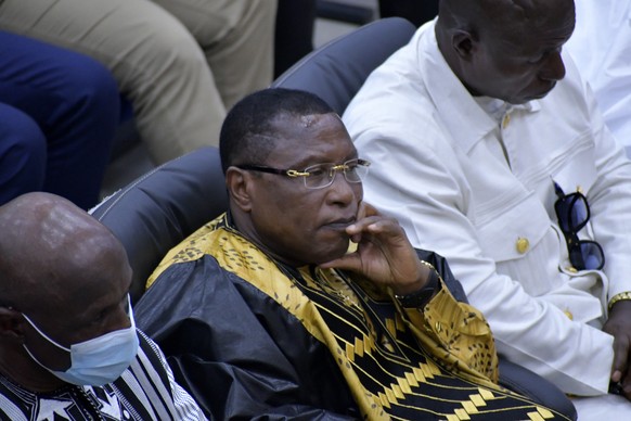 Former junta leader Moussa ?Dadis? Camara, left, listens during a court verdict in Conakry, Guinea Wednesday, July. 31, 2024. A Guinea court has sentenced Camara to 20 years in prison after finding hi ...