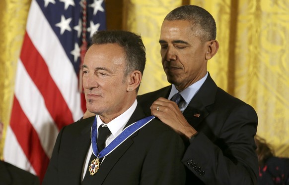 Musician Bruce Springsteen (L) receives the Presidential Medal of Freedom from U.S. President Barack Obama during a ceremony in the East Room of the White House in Washington, U.S., November 22, 2016. ...