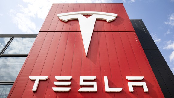 epa12069130 The logo of Tesla on its European headquarters in Amsterdam, the Netherlands, 02 May 2025. Sales of Tesla vehicles in the Netherlands dropped by nearly 74% in April compared with the same  ...