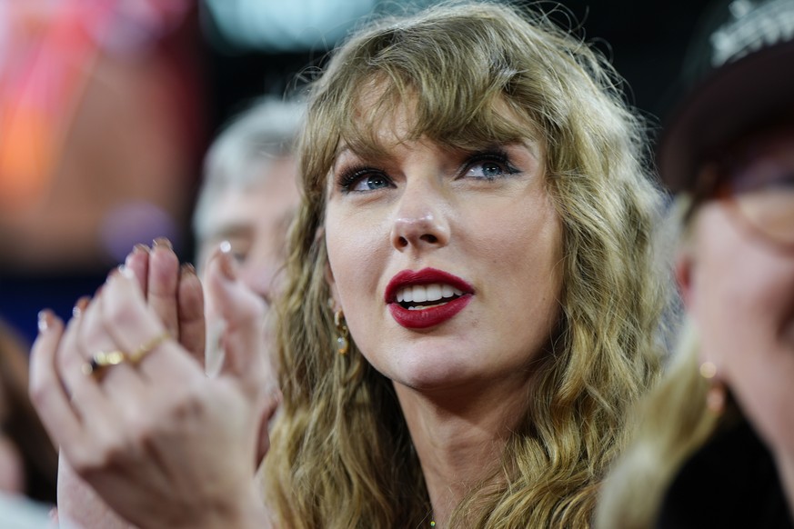 FILE - Taylor Swift stands on the field after an AFC Championship NFL football game between the Baltimore Ravens and the Kansas City Chiefs, Sunday, Jan. 28, 2024, in Baltimore. States were already so ...