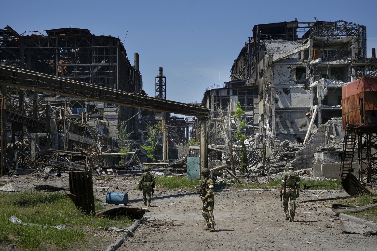 FILE - Russian soldiers patrol an area of the Metallurgical Combine Azovstal, in Mariupol, on the territory which is under the Government of the Donetsk People&#039;s Republic control, eastern Ukraine ...