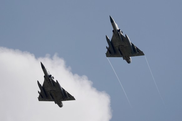 epa10109621 Two Taiwanese Air Force Mirage 2000-5 fighter jets fly by an airbase in Hsinchu, Taiwan, 07 August 2022. Following a visit of US House of Representatives Speaker Pelosi to Taiwan, the Chin ...