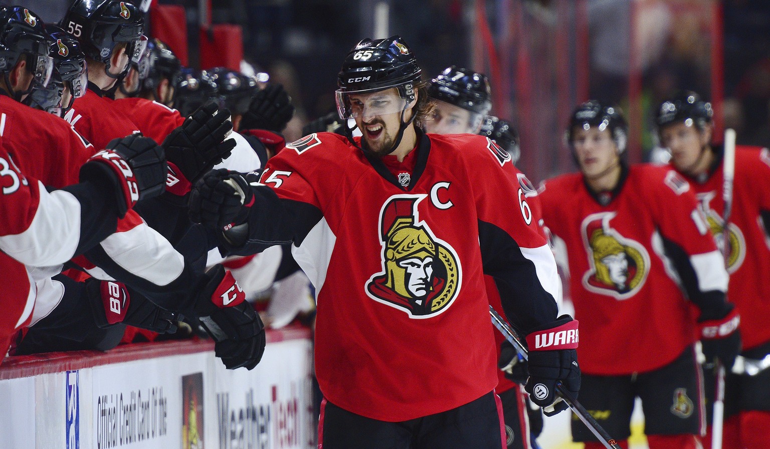 Ottawa Senators captain Erik Karlsson celebrates his goal with the bench during the first period of an NHL hockey game against the Ottawa Senators on Saturday, Dec. 3, 2016, in Ottawa, Ontario. (Sean  ...