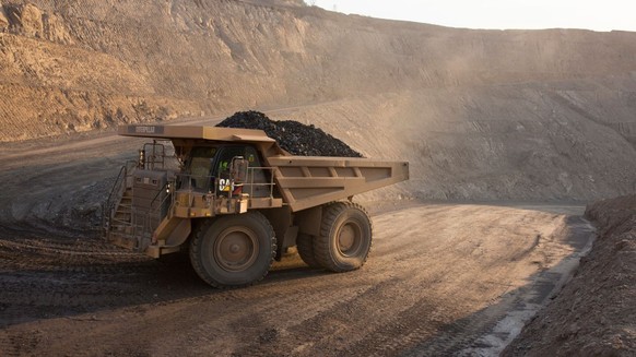 KOLWEZI, DRC- JULY 7: The sun sets on one of the open pit copper mines at Mutanda Mining Sarl on July 6, 2016 in Kolwezi, DRC. The mine is owned (69%) by Glencore, an Anglo-Swiss multinational commodi ...