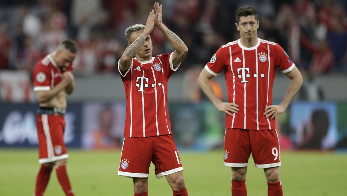 Bayern's Franck Ribery, Rafinha and Robert Lewandowski, from left, look disappointed after losing 1-2 during the semifinal first leg soccer match between FC Bayern Munich and Real Madrid at the A ...