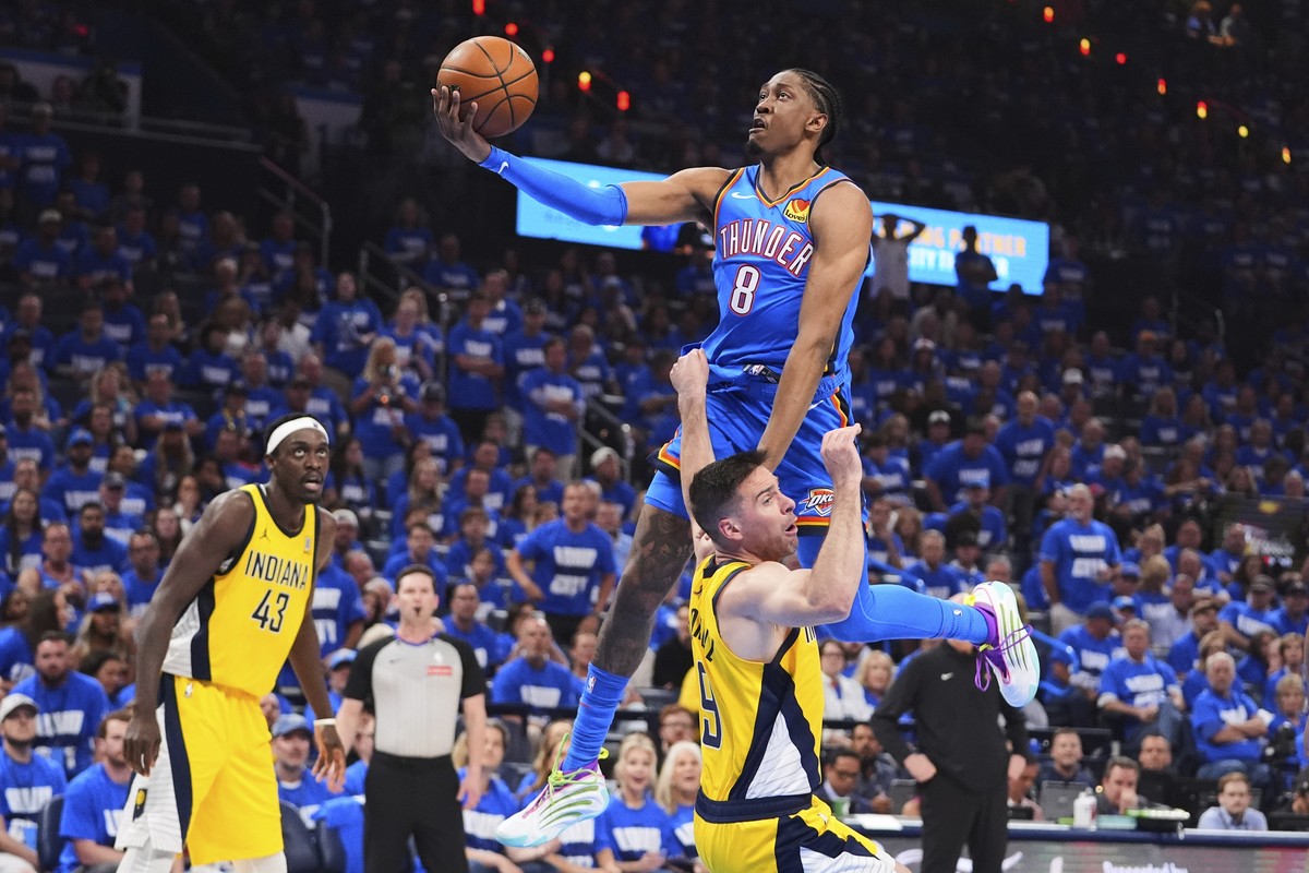 Oklahoma City Thunder forward Jalen Williams (8) shoots against Indiana Pacers guard T.J. McConnell (9) during the first half of Game 2 of the NBA Finals basketball series Sunday, June 8, 2025, in Okl ...