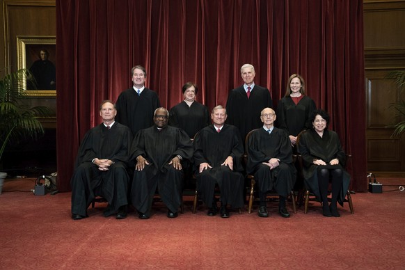 FILE - In this April 23, 2021, file photo members of the Supreme Court pose for a group photo at the Supreme Court in Washington. Seated from left are Associate Justice Samuel Alito, Associate Justice ...