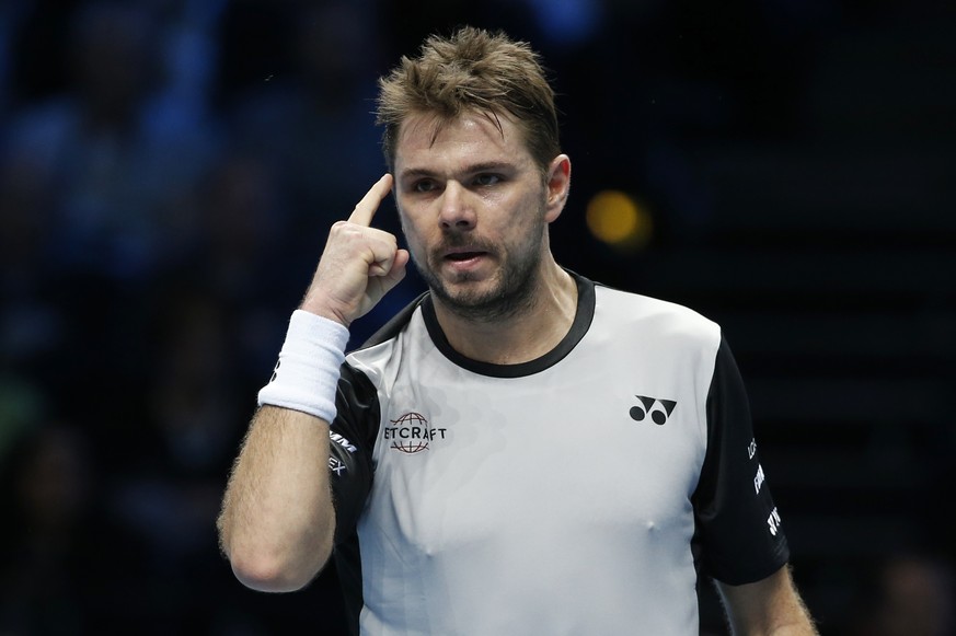 Switzerland&#039;s Stan Wawrinka reacts after winning the first set against Croatia&#039;s Marin Cilic during their ATP World Tour Finals singles tennis match at the O2 arena in London, Wednesday, Nov ...