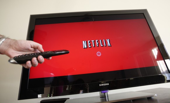 REMOVES 2015 AFTER FEBRUARY - FILE - In this July 20, 2010 file photo, a person uses Netflix in Palo Alto, Calif. Satellite TV provider Dish Network on Wednesday, Dec. 17, 2014 said that it is adding  ...