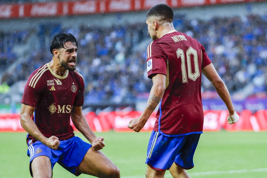 Servette&#039;s defender Nicolas Vouilloz, left, and Servette&#039;s midfielder Alexis Antunes, right, let their joy burst after the 2:2, during the UEFA Champions League Second qualifying round first ...