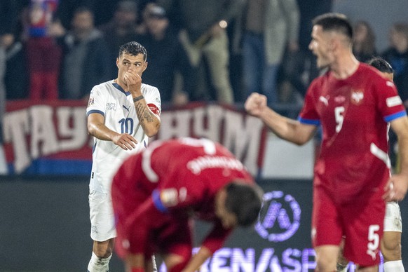 Granit Xhaka, left, from Switzerland reacts after the 2:0 goal for Serbia during the UEFA Nations League group A4 qualifying soccer match between Serbia and Switzerland, at the Dubocica Stadium, in Le ...
