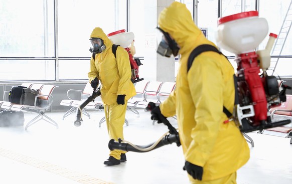 epa09471431 Russian Emergency Situations Ministry workers sanitise Belorussky railway station as part of the campaign to prevent the spread of the SARS-CoV-2 coronavirus which causes the COVID-19 dise ...