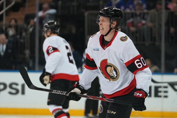 Ottawa Senators' Lassi Thomson (60) reacts after getting hurt during the second period of an NHL hockey game against the New York Rangers Monday, March 23, 2026, in New York. (AP Photo/Frank Fran ...