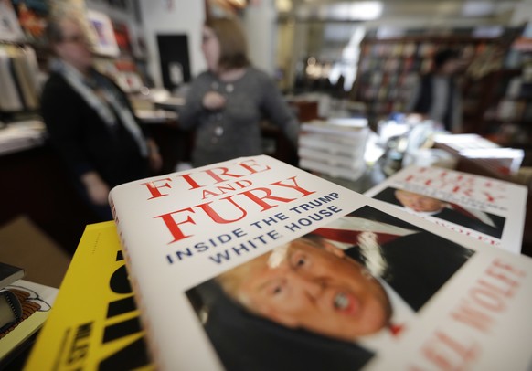 Copies of the book &quot;Fire and Fury: Inside the Trump White House&quot; by Michael Wolff are displayed at Barbara&#039;s Books Store, Friday, Jan. 5, 2018, in Chicago. (AP Photo/Charles Rex Arbogas ...