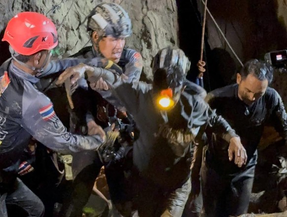 epa13002780 A handout photo made available by Metta Tham Kalasin Rescue shows a Laotian survivor rescued from a flooded cave in a mountainous area in Xaysomboun province, Laos, 29 May 2026. One of sev ...