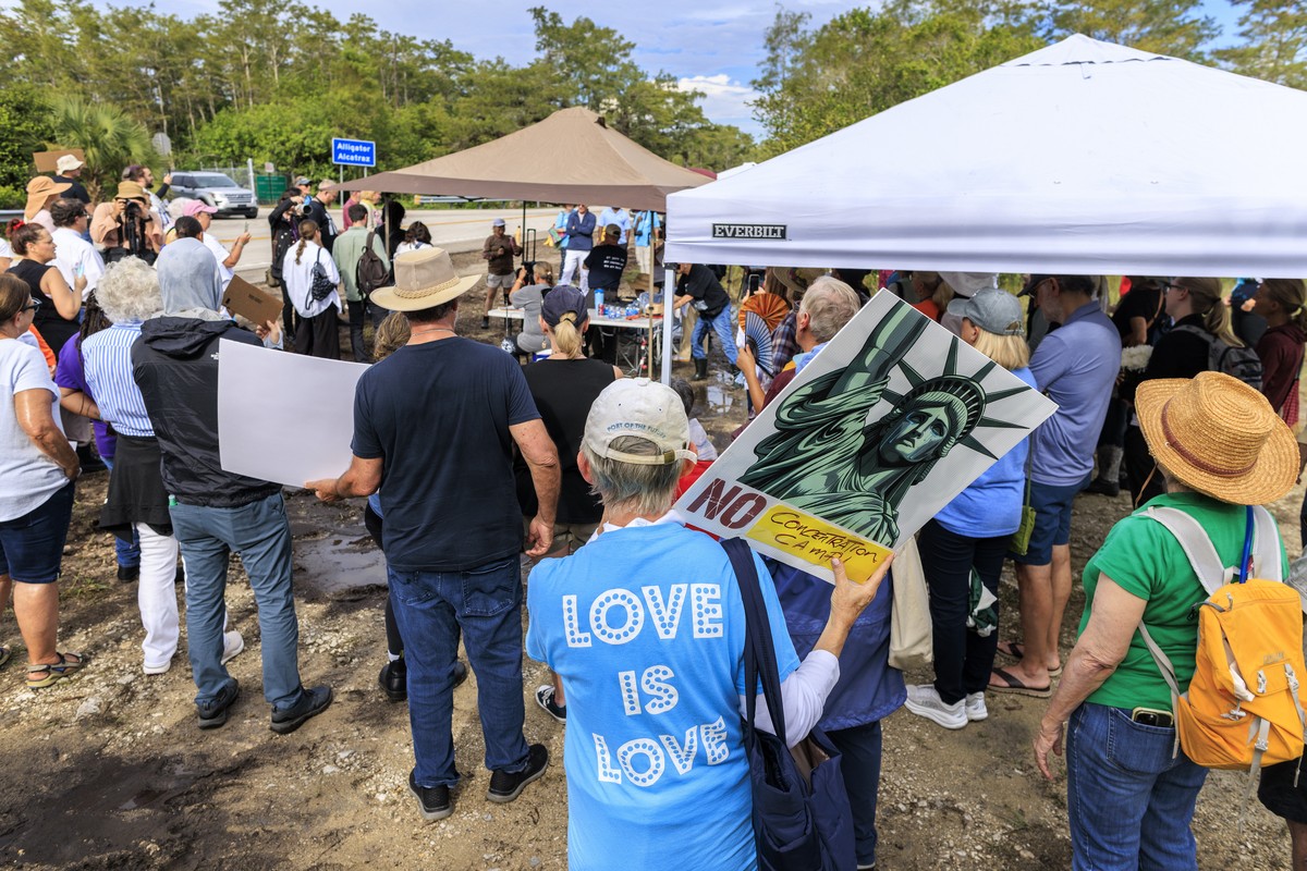 epa12293022 Immigration activists and family members of detainees attend a vigil outside Alligator Alcatraz detention center in Ochopee, Florida, USA, 10 August 2025. According to organizers, detainee ...