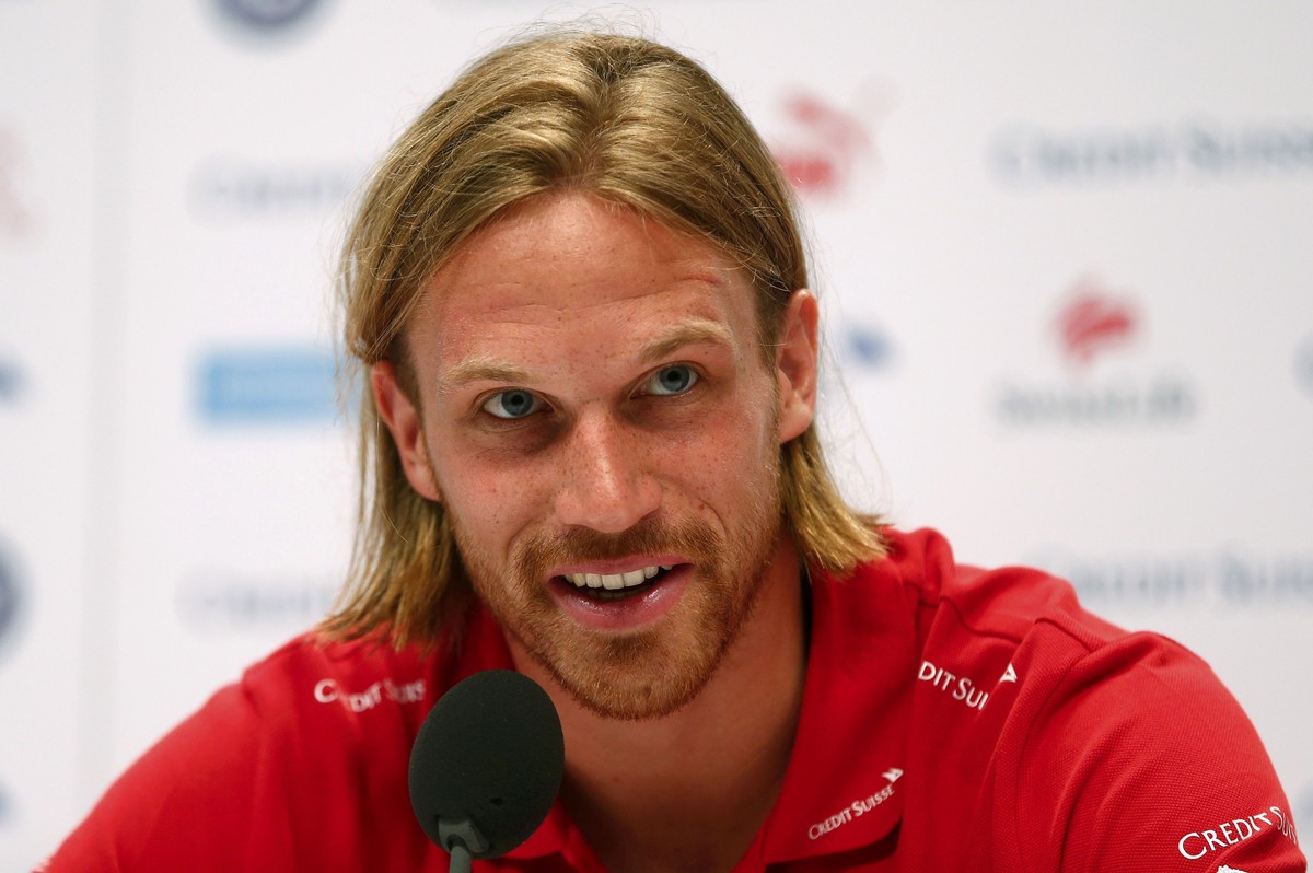 Switzerland's national soccer team player Michael Lang addresses a news conference in Porto Seguro June 29, 2014. REUTERS/Arnd Wiegmann (BRAZIL - Tags: SOCCER SPORT WORLD CUP HEADSHOT)