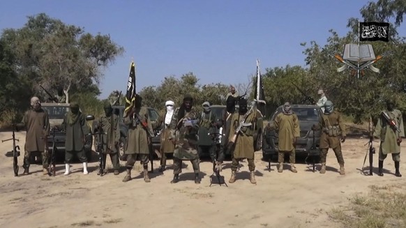 FILE - In his file image taken from video released late Friday evening, Oct. 31, 2014, by Boko Haram, Abubakar Shekau, centre, the leader of Nigeria&#039;s Islamic extremist group. Boko Haram fighters ...