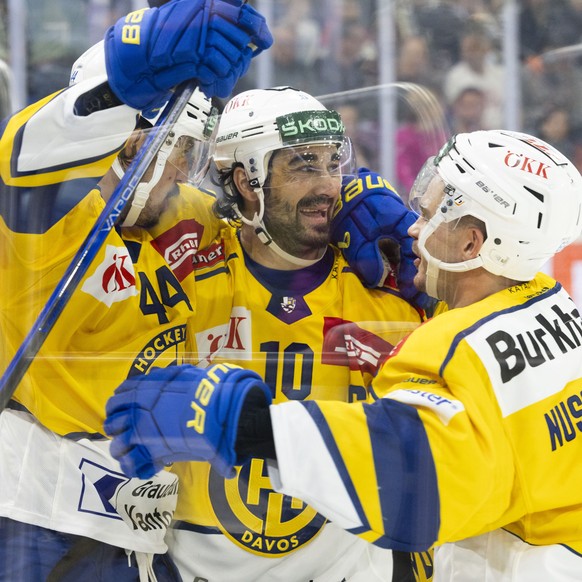 From left Davos&#039;s player Matej Stransky, Davos&#039;s player Andres Amb