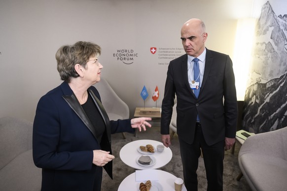 Viola Amherd, left, Minister of Defence of Switzerland, talks with Alain Berset, right, President of the Switzerland before a bilateral meeting at the 53rd annual meeting of the World Economic Forum,  ...