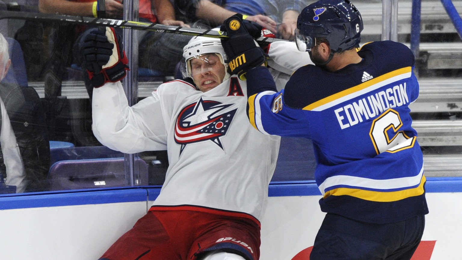 St. Louis Blues&#039; Joel Edmundson (6) checks Columbus Blue Jackets&#039; Calvin Thurkauf, left, of Switzerland, during the third period of an NHL preseason hockey game, Wednesday, Sept. 20, 2017, i ...