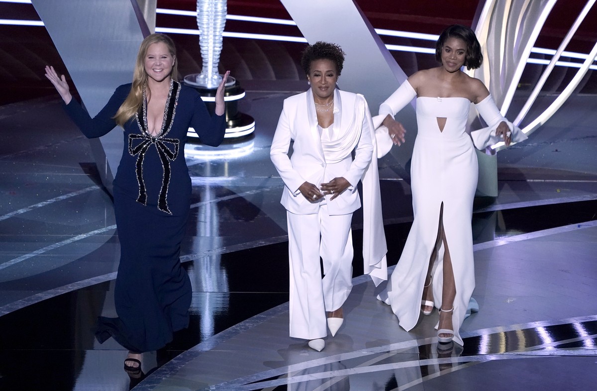 Hosts Amy Schumer, from left, Wanda Sykes, and Regina Hall appear on stage at the Oscars on Sunday, March 27, 2022, at the Dolby Theatre in Los Angeles. (AP Photo/Chris Pizzello)
Amy Schumer,Wanda Syk ...