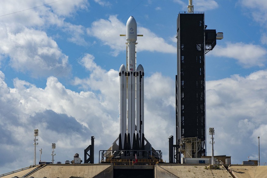 This Wednesday, April 10, 2019 photo made available by SpaceX shows a Falcon Heavy SpaceX rocket on pad 39A at the Kennedy Space Center in Cape Canaveral, Fla., after the launch was scrubbed Wednesday ...