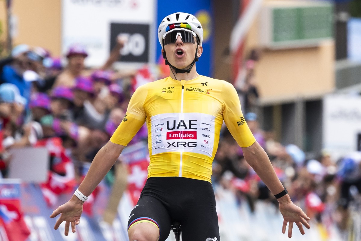 Tadej Pogacar from Slovenia of UAE Team Emirates XRG raises his arms after crossing the finish line to win during the fifth and last stage, a 178,2 km race between Lucens and Leysin at the 79th Tour d ...