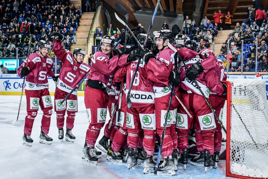 Sparta`s team celebrate after winning the semi final the game between Czech Republic&#039;s HC Sparta Praha and Sweden&#039;s Oerebro HK, at the 94th Spengler Cup ice hockey tournament in Davos, Switz ...