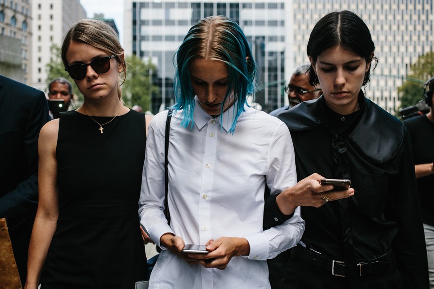 epa07798201 An unidentified alleged victim (C) of deceased financier Jeffrey Epstein, exits the United States Federal Courthouse in New York, New York, USA, 27 August 2019. Epstein&#039;s accusers att ...