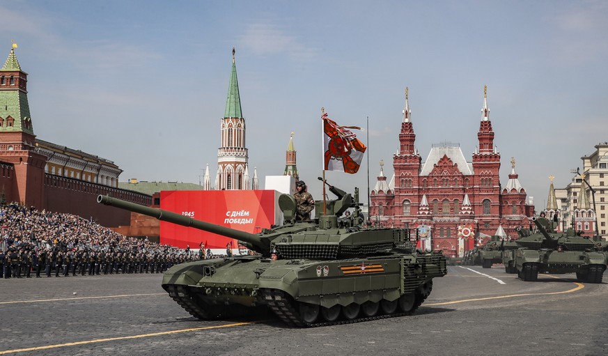 epa09931252 Russian T-90M and T-14 Armata tanks take part in the Victory Day military parade general rehearsal in the Red Square in Moscow, Russia, 07 May 2022. The Victory Day military parade will ta ...