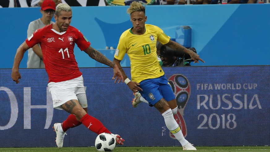 Switzerland&#039;s Valon Behrami, left, vies for the ball with Brazil&#039;s Neymar during the group E match between Brazil and Switzerland at the 2018 soccer World Cup in the Rostov Arena in Rostov-o ...