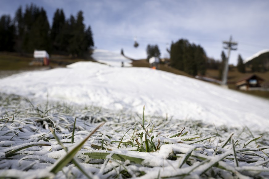 Artificial snow covers grass close to the finish area under construction of the the Alpine Skiing FIS Ski World Cup, at Adelboden, Switzerland, Wednesday, December 28, 2022.The alpine skiing World Cup ...