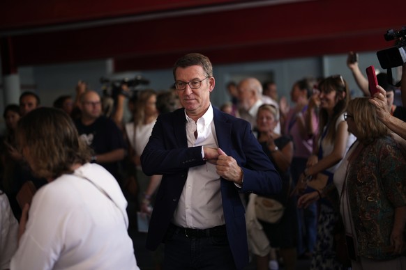 Popular Party leader Alberto Nunez Feijoo leaves a polling station after voting in Madrid, Spain, Sunday July 23, 2023. Spain is holding general elections, that could make the country the latest Europ ...