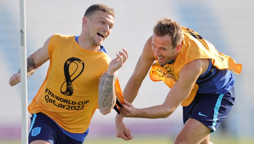 epa10324753 England players Kieran Trippier (L) and Harry Kane during a training session of the English national soccer team in Doha, Qatar, 24 November 2022. England will face USA on 25 November thei ...
