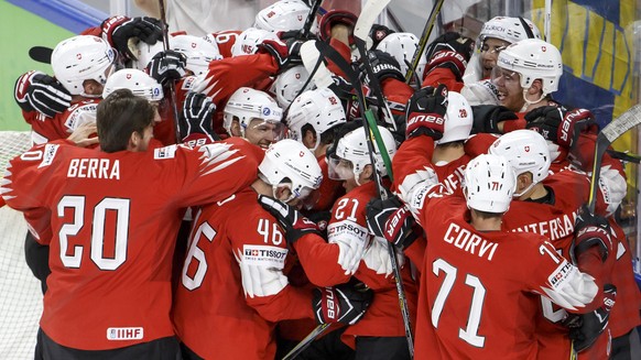 Switzerland&#039;s players celebrate their victory after beating Canada, during the IIHF 2018 World Championship semi final game between Canada and Switzerland, at the Royal Arena, in Copenhagen, Denm ...