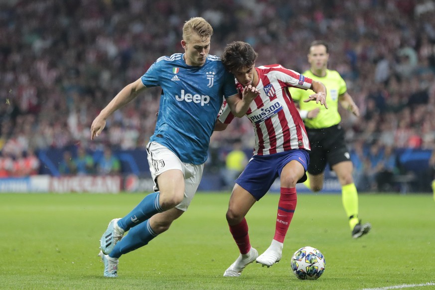 Atletico Madrid's Joao Felix, right, and Juventus' Matthijs de Ligt vie for the ball during the Champions League Group D soccer match between Atletico Madrid and Juventus at the Wanda Metrop ...