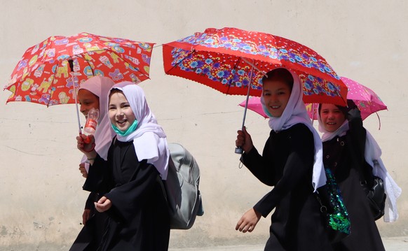 epa09450022 Afghan school girls leave after school hours in Kabul, Afghanistan, 05 September 2021. The Taliban on 02 September, said th?ey have completed the consultation on government formation but w ...
