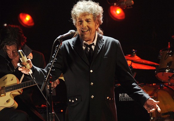 FILE - Bob Dylan performs in Los Angeles on Jan. 12, 2012. Dylan has a new book coming out this fall, a collection of more than 60 essays about songs and songwriters he admires, from Stephen Foster to ...