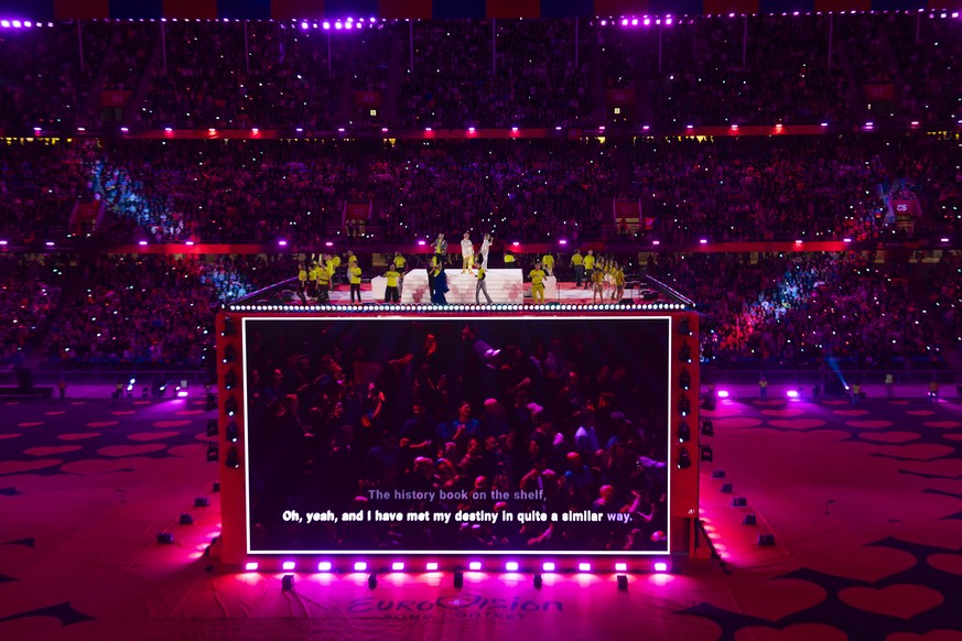 epa12111093 People sing Waterloo by Abba as karaoke in the Arena Plus a public viewing in St. Jakob Park, during the grand-final at the 69th Eurovision Song Contest in Basel, Switzerland, 17 May 2025. ...