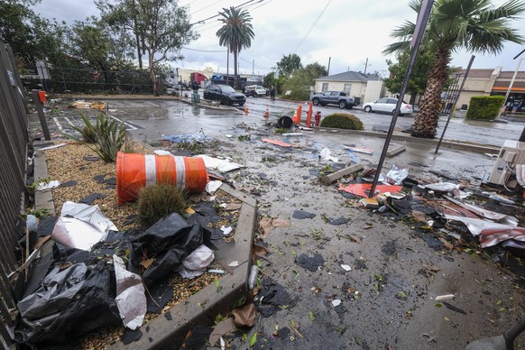 Debris is seen after a strong microburst damaged several buildings Wednesday, March 22, 2023 in Montebello, Calif. (AP Photo/Ringo H.W. Chiu)