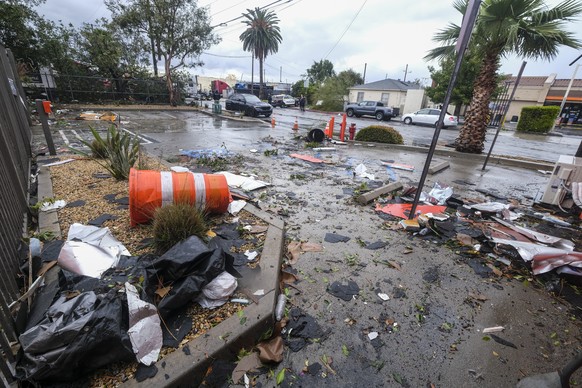 Debris can be seen after a strong microburst damaged several buildings on Wednesday, March 22, 2023 in Montebello, California.  (AP Photo/Ringo HW Chiu)