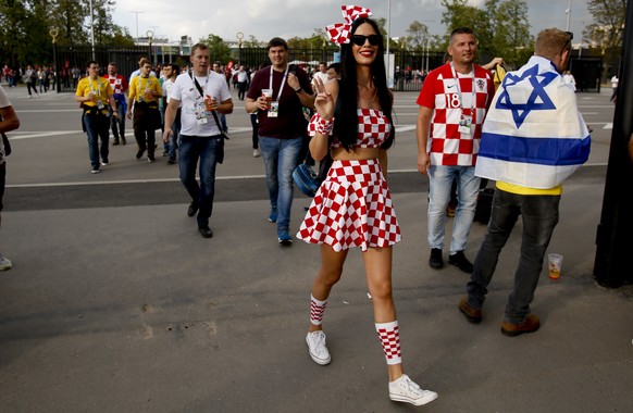 A Croatia fan arrives for the semifinal match between Croatia and England at the 2018 soccer World Cup in the Luzhniki Stadium in Moscow, Russia, Wednesday, July 11, 2018. (AP Photo/Rebecca Blackwell)