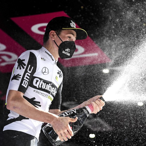 Switzerland&#039;s Mauro Schmid celebrates on the podium winning the eleventh stage of the Giro d&#039;Italia cycling race, from Perugia to Montalcino, Italy, Wednesday, May 19, 2021. (Marco Alpozzi/L ...