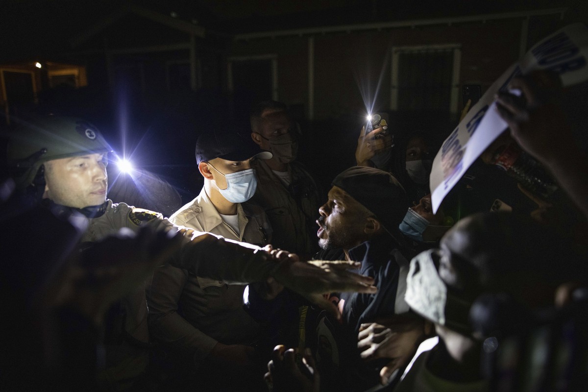 Protesters clash with deputies of the Los Angeles Sheriff's Department during protests following the death of Dijon Kizzee on Monday, Aug. 31, 2020, in Los Angeles, Calif. (AP Photo/Christian Mon ...
