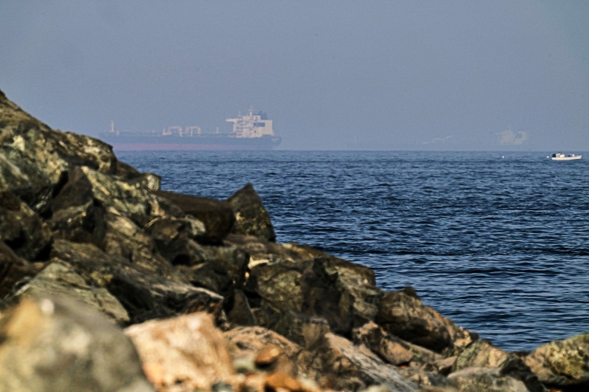 FILE - Cargo ships are seen at sea in the Gulf of Oman near the Strait of Hormuz, from a rocky shoreline near Khor Fakkan, United Arab Emirates, May 1, 2026. (AP Photo/Fatima Shbair, File)
Mideast Oma ...
