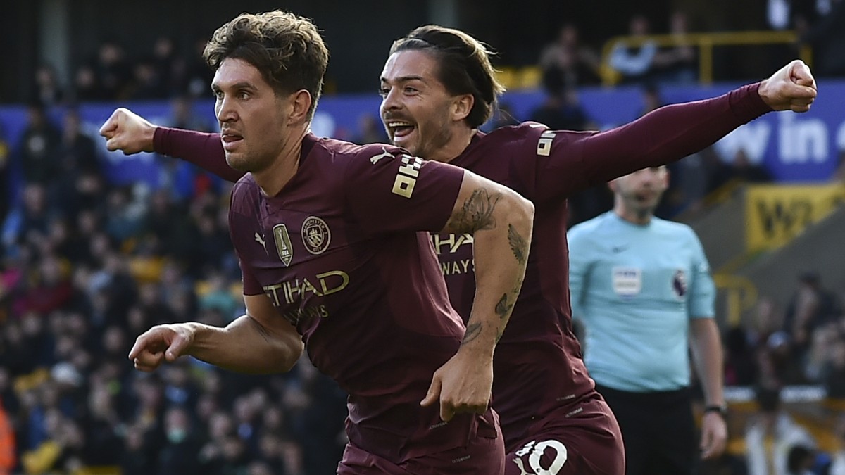 Manchester City's John Stones celebrates scoring his side's 2nd goal during the English Premier League soccer match between Wolverhampton Wanderers and Manchester City at the Molineux Stadiu ...
