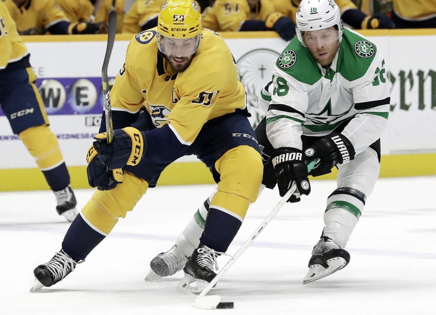 Dallas Stars center Joe Pavelski (16) battles for the puck with Nashville Predators defenseman Roman Josi (59), of Switzerland, in the second period of an NHL hockey game, Saturday, Dec. 14, 2019, in  ...